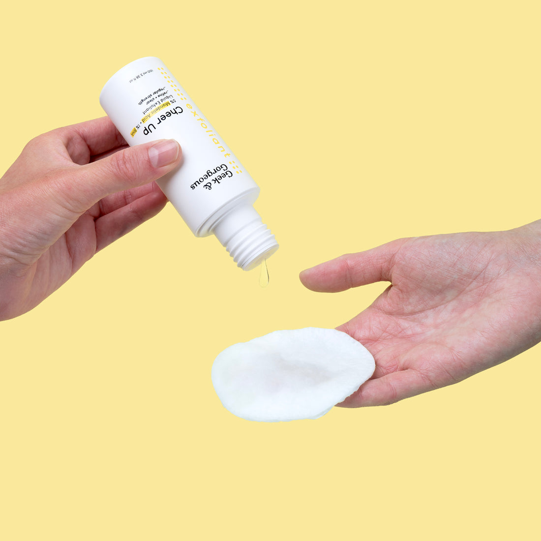 A bottle of full-sized Cheer Up exfoliator on white background.